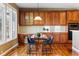 Eat-in kitchen features ample wood cabinetry, stainless appliances, and a sun-filled eating nook at 5017 Bella Vista Dr, Longmont, CO 80503