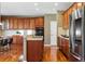 Cherry wood kitchen cabinets, stainless appliances, and an open concept design for entertaining at 5017 Bella Vista Dr, Longmont, CO 80503