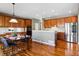 Spacious eat-in kitchen features wood floors, stainless appliances, and a breakfast bar at 5017 Bella Vista Dr, Longmont, CO 80503