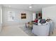 Airy living room provides ample space with soft carpet and natural light at 5017 Bella Vista Dr, Longmont, CO 80503