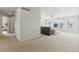Open-concept living area with ample natural light featuring a neutral palette and carpet at 5017 Bella Vista Dr, Longmont, CO 80503