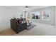 Bright living room with neutral decor, large windows, and comfortable seating at 5017 Bella Vista Dr, Longmont, CO 80503
