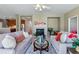 Open living room showing fireplace, comfortable seating, and connection to kitchen at 5017 Bella Vista Dr, Longmont, CO 80503