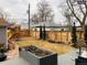 Backyard featuring wooden fence, play structure, and greenery at 4428 Perry St, Denver, CO 80212