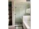 Modern bathroom with a glass-enclosed shower, soaking tub, and stylish finishes for relaxation at 4428 Perry St, Denver, CO 80212
