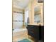 Bathroom with tiled shower and vanity at 4428 Perry St, Denver, CO 80212