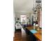 Well-lit living room with a dining area, hardwood floors, and contemporary decor at 4428 Perry St, Denver, CO 80212
