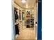Organized walk-in closet with custom shelving, drawers, and ample storage space for clothes and shoes at 4428 Perry St, Denver, CO 80212
