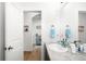 Well-lit bathroom with marble countertop, framed mirror, and stylish decor at 720 Remington Dr, Hudson, CO 80642