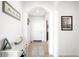 Inviting foyer with neutral walls, wood floors, and console table at 720 Remington Dr, Hudson, CO 80642