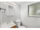 Bathroom featuring vanity, mirror, updated light fixture, and toilet at 387 Tucson St, Aurora, CO 80011