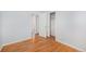 Cozy bedroom featuring hardwood floors, closet space, and neutral paint at 387 Tucson St, Aurora, CO 80011