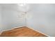 Well-lit bedroom with hardwood floors and neutral walls, ready for personalization at 387 Tucson St, Aurora, CO 80011