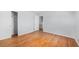 Cozy bedroom features hardwood floors, closet and fresh light gray paint at 387 Tucson St, Aurora, CO 80011