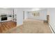 Open concept kitchen flowing into living room with fireplace at 387 Tucson St, Aurora, CO 80011
