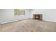 Inviting living room with a cozy fireplace and a large window at 387 Tucson St, Aurora, CO 80011