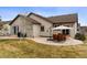 A lovely patio in the backyard with outdoor furniture for relaxing and entertaining at 4143 Eagle Ridge Way, Castle Rock, CO 80104