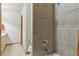 Shower with tile surround and neutral tones at 4143 Eagle Ridge Way, Castle Rock, CO 80104