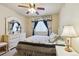 This bedroom features elegant black and white patterned bedding and matching window treatments at 4143 Eagle Ridge Way, Castle Rock, CO 80104