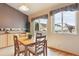 Cozy breakfast nook with a table and chairs bathed in natural sunlight at 4143 Eagle Ridge Way, Castle Rock, CO 80104