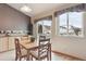 Cozy dining area with light wood floors and a view of the backyard at 4143 Eagle Ridge Way, Castle Rock, CO 80104