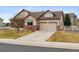 Charming two-story home with a well-manicured lawn and inviting curb appeal at 4143 Eagle Ridge Way, Castle Rock, CO 80104