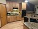 Well-lit kitchen with granite countertops, modern appliances, and light wood cabinets and floors at 4143 Eagle Ridge Way, Castle Rock, CO 80104