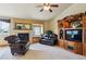 Comfortable living room with a fireplace, custom built-ins, and lots of natural light at 4143 Eagle Ridge Way, Castle Rock, CO 80104