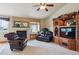 Comfortable living room featuring a fireplace, entertainment center, and cozy seating at 4143 Eagle Ridge Way, Castle Rock, CO 80104