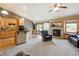 Open concept living room with kitchen, dining area, fireplace, and lots of natural light at 4143 Eagle Ridge Way, Castle Rock, CO 80104