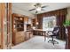 Office space with built-in wooden cabinetry, a desk, and a comfortable office chair at 4143 Eagle Ridge Way, Castle Rock, CO 80104