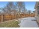 Backyard with wooden fence and patchy snow cover at 20351 E Lasalle Pl, Aurora, CO 80013