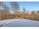 Backyard with wooden fence and patchy snow cover at 20351 E Lasalle Pl, Aurora, CO 80013