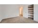 Bedroom with built-in shelving and access to hallway at 20351 E Lasalle Pl, Aurora, CO 80013