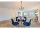 Bright dining area with a four-person table and access to the living room at 20351 E Lasalle Pl, Aurora, CO 80013