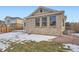 Brick house exterior with windows and snow on ground at 20351 E Lasalle Pl, Aurora, CO 80013