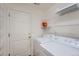 Laundry room with washer, dryer, and ample shelving at 20351 E Lasalle Pl, Aurora, CO 80013