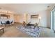 Open living and dining area with neutral decor and carpeted floors at 20351 E Lasalle Pl, Aurora, CO 80013