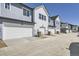 Charming townhomes featuring attached garages and a mix of modern siding and architectural styles in a community setting at 6562 Arbor Blvd # 3, Thornton, CO 80602