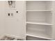 Laundry room with shelving and tile flooring at 6562 Arbor Blvd # 3, Thornton, CO 80602