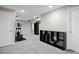 Spacious basement featuring exercise equipment and ample storage space, offering versatility and functionality for various activities at 1343 Valentia St, Denver, CO 80220