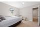 Bright bedroom with a ceiling fan, large window, and a comfortable bed, providing a cozy and inviting space at 1343 Valentia St, Denver, CO 80220