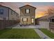 Charming home with a manicured front yard, patio seating, and awning, perfect for relaxing and enjoying the outdoors at 1343 Valentia St, Denver, CO 80220