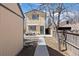 Charming home featuring a patio, awning, and inviting entrance from the backyard at 1343 Valentia St, Denver, CO 80220