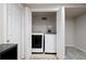 Convenient laundry area featuring modern washer and dryer, perfect for efficient home maintenance at 1343 Valentia St, Denver, CO 80220
