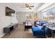Stylish living room with bright natural light, a comfortable blue sofa and an inviting, modern aesthetic at 1343 Valentia St, Denver, CO 80220