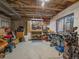 Unfinished basement space with lots of potential, featuring a sliding glass door and a workbench at 6348 Deframe Way, Arvada, CO 80004