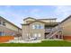 A well-maintained backyard featuring a concrete patio with outdoor seating and a built-in grill for entertaining at 14102 Night Owl Ln, Parker, CO 80134