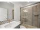 Elegant bathroom with a glass-enclosed shower, mosaic tile accents, and a modern vanity at 14102 Night Owl Ln, Parker, CO 80134