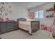 Bright bedroom with natural light, a large dresser, and charming décor at 14102 Night Owl Ln, Parker, CO 80134